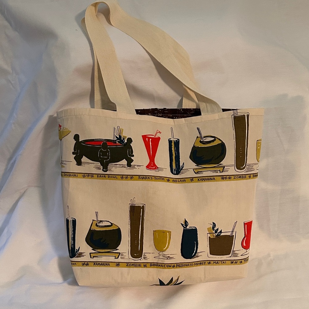 One of a kind vintage Hawaiian Tiki tote. Lined and sturdy with inside pocket.